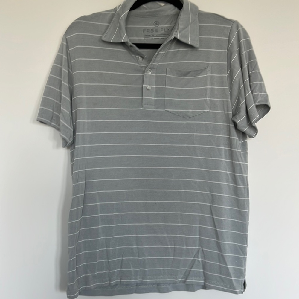 Men’s free fly polo. Grey and white stripe. Size small
